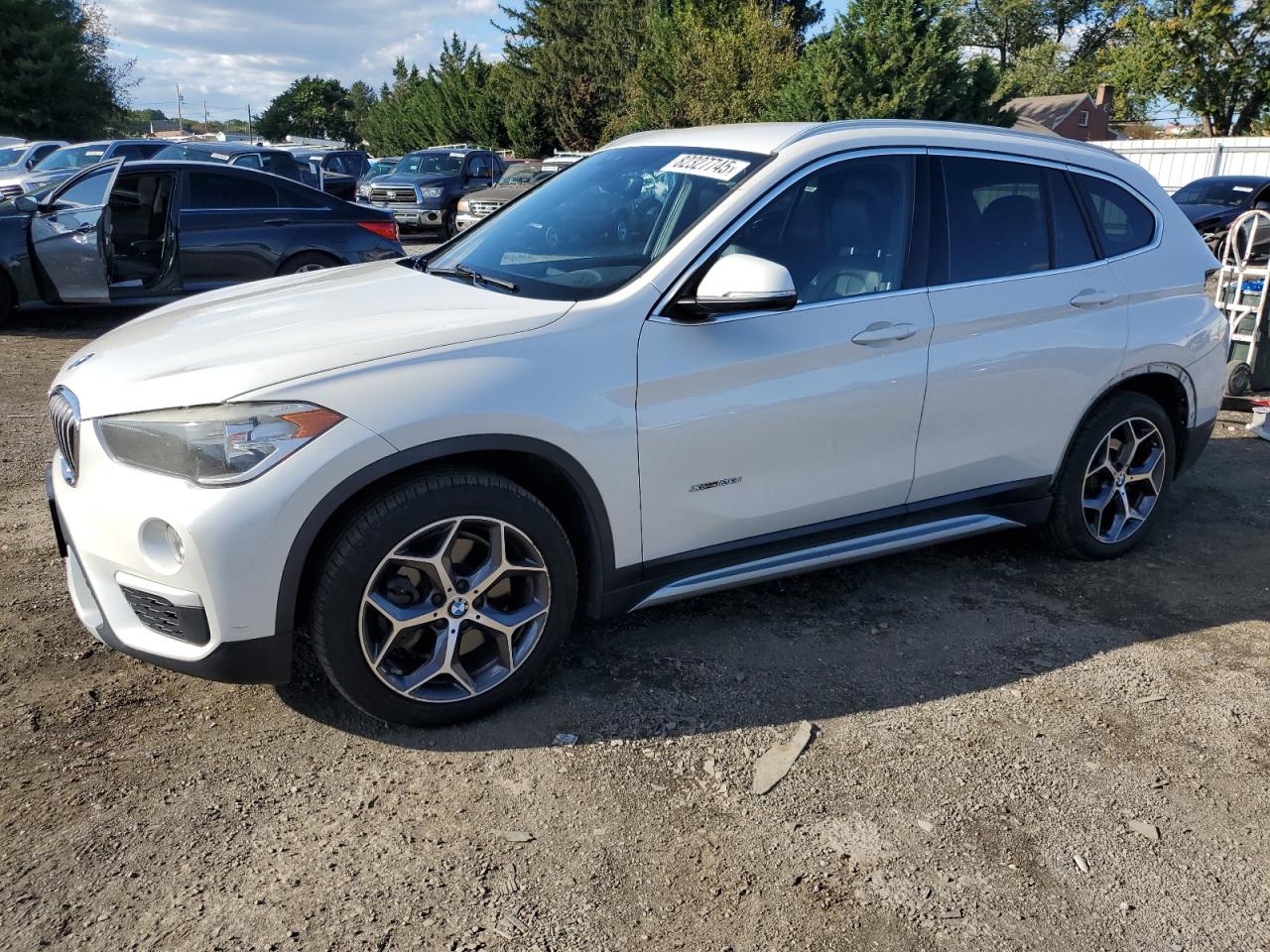 2018 BMW X1 xDrive28i, VIN WBXHT3C34J5K30245 — Rear end