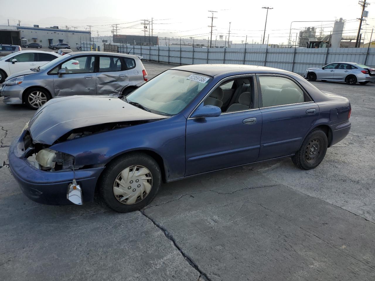 1999 Mazda 626 ES, VIN 1YVGF22C1X5885994 — Front end