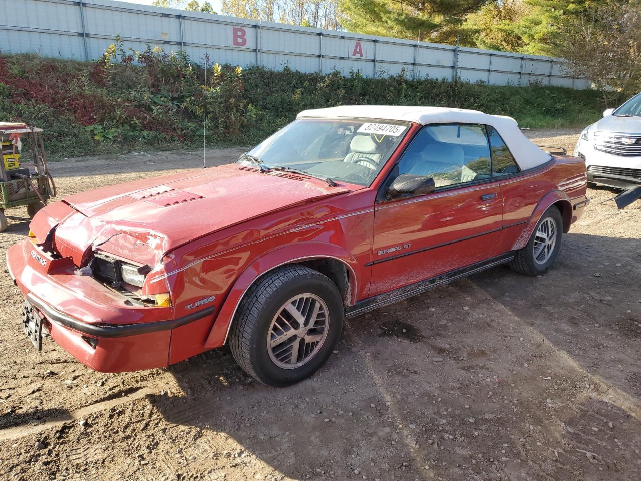 1989 Pontiac Sunbird, VIN 1G2JU31M3K7500700 — Front end