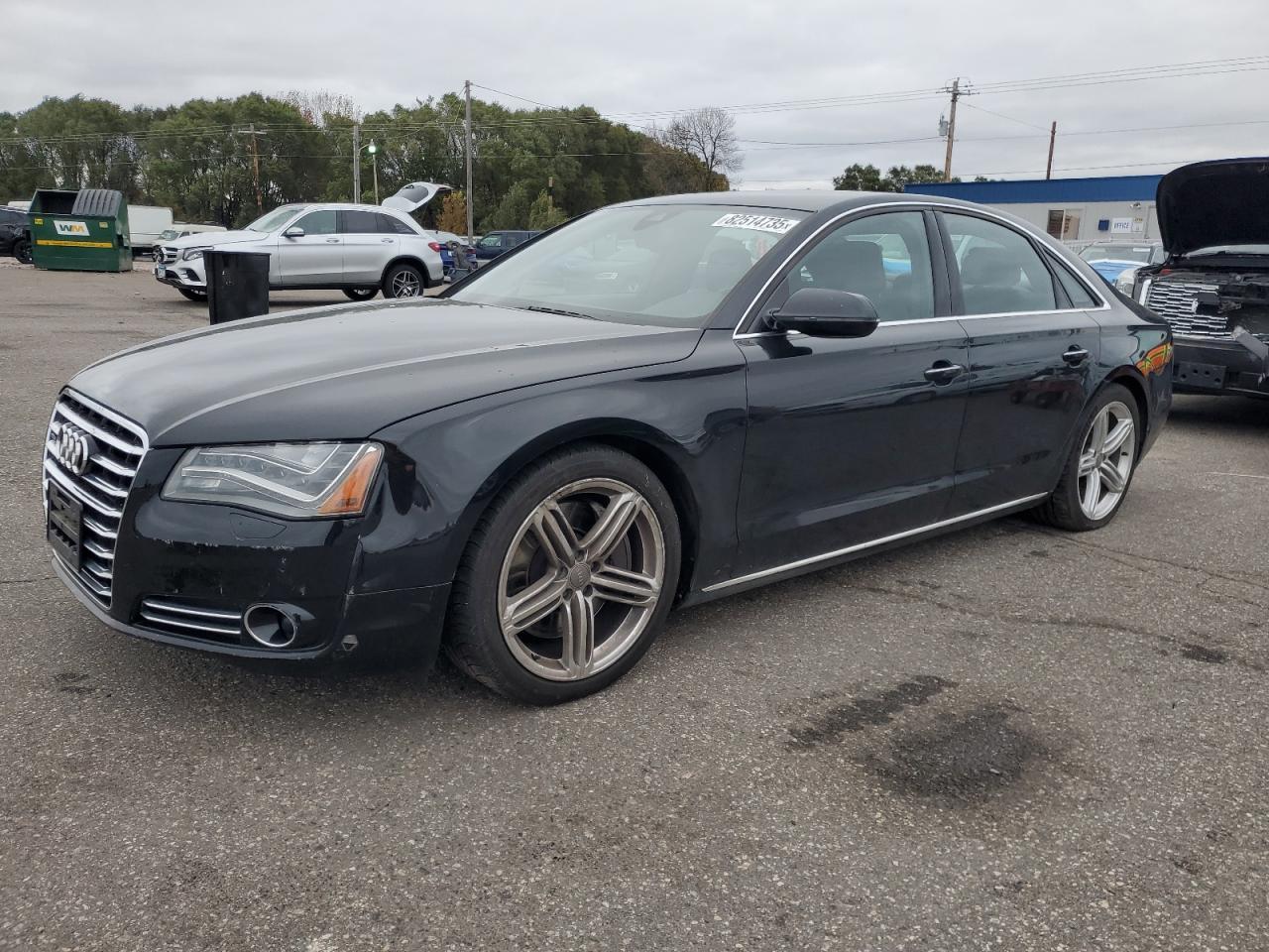 2011 Audi A8, VIN WAUAVAFDXBN024380 — Auction photo