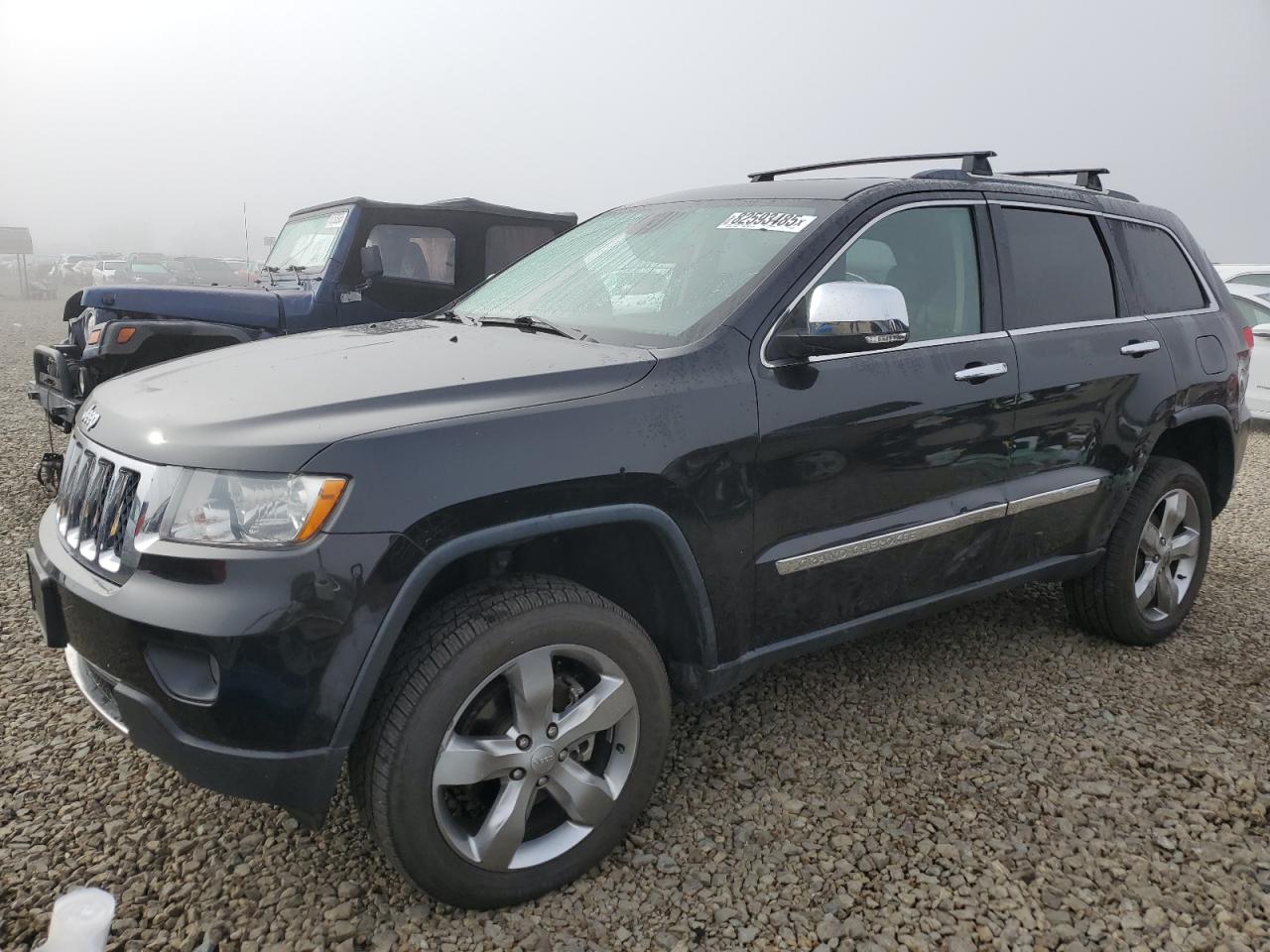 2013 Jeep Grand Cherokee Overland Summit, VIN 1C4RJFCG8DC653146 — Side
