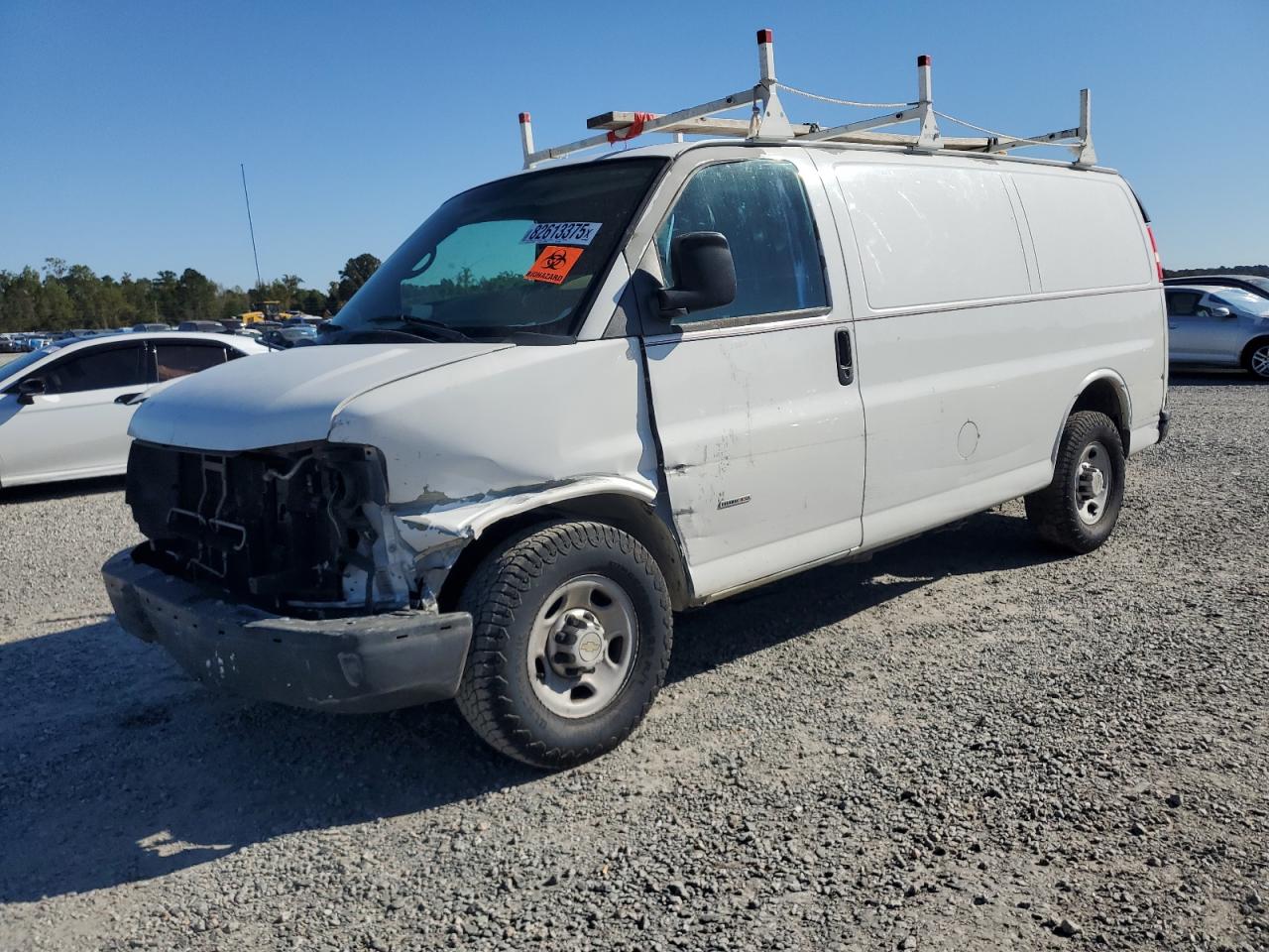 2012 Chevrolet Express G2500, VIN 1GCWGFCL5C1120549 — Side