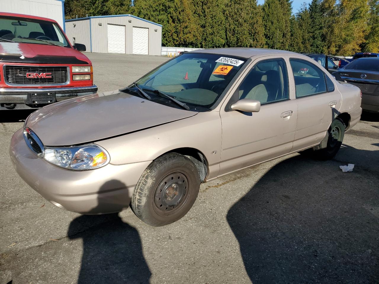 1999 Ford Contour LX, VIN 1FAFP6534XK185279 — Minor dents and scratches