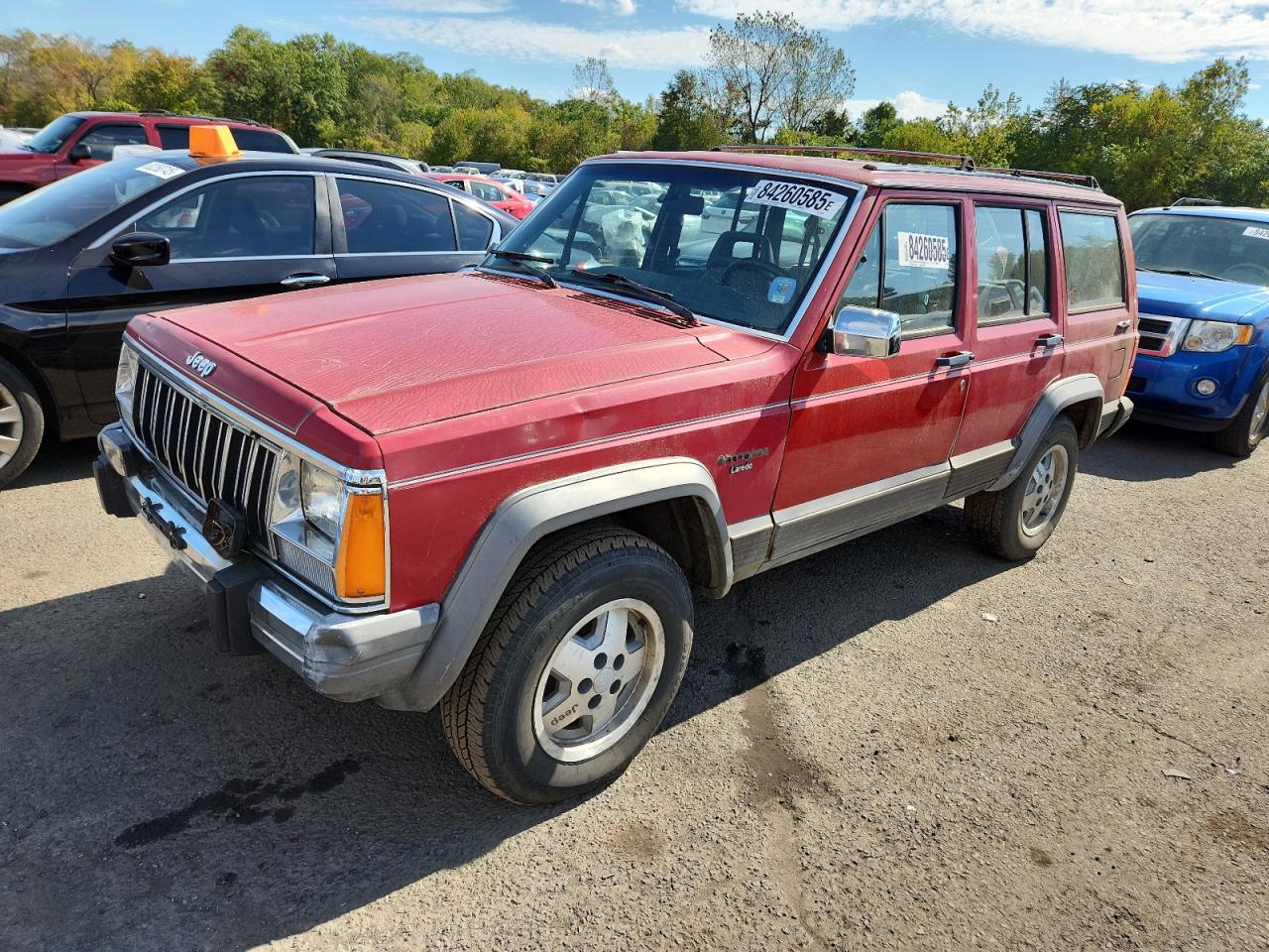 1990 Jeep Cherokee Laredo, VIN 1J4FJ58L0LL208654 — Side