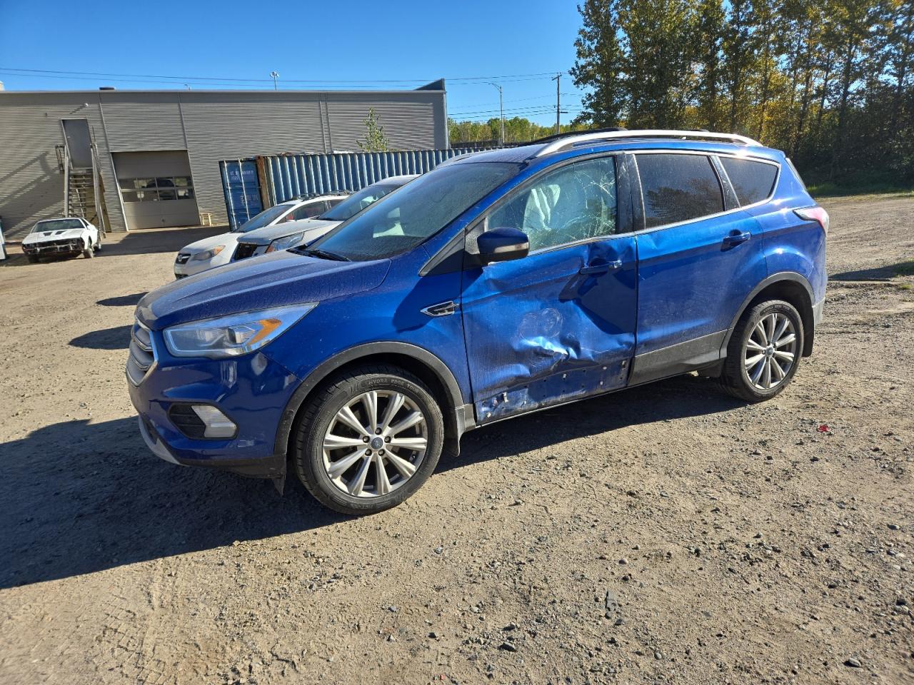 2018 Ford Escape Titanium, VIN 1FMCU9J91JUD45482 — Side