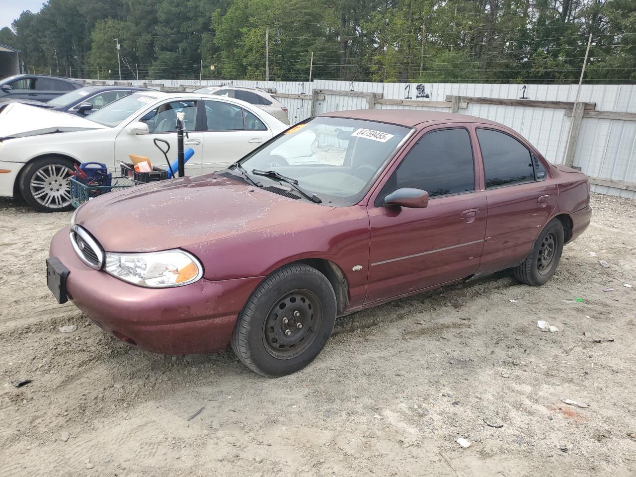 1999 Ford Contour LX, VIN 1FAFP653XXK106939 — Side