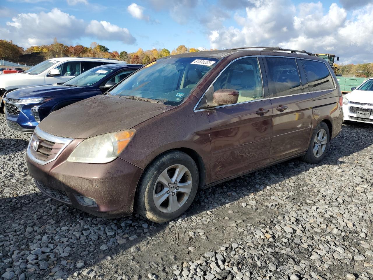 2010 Honda Odyssey Touring, VIN 5FNRL3H97AB017089 — Front end