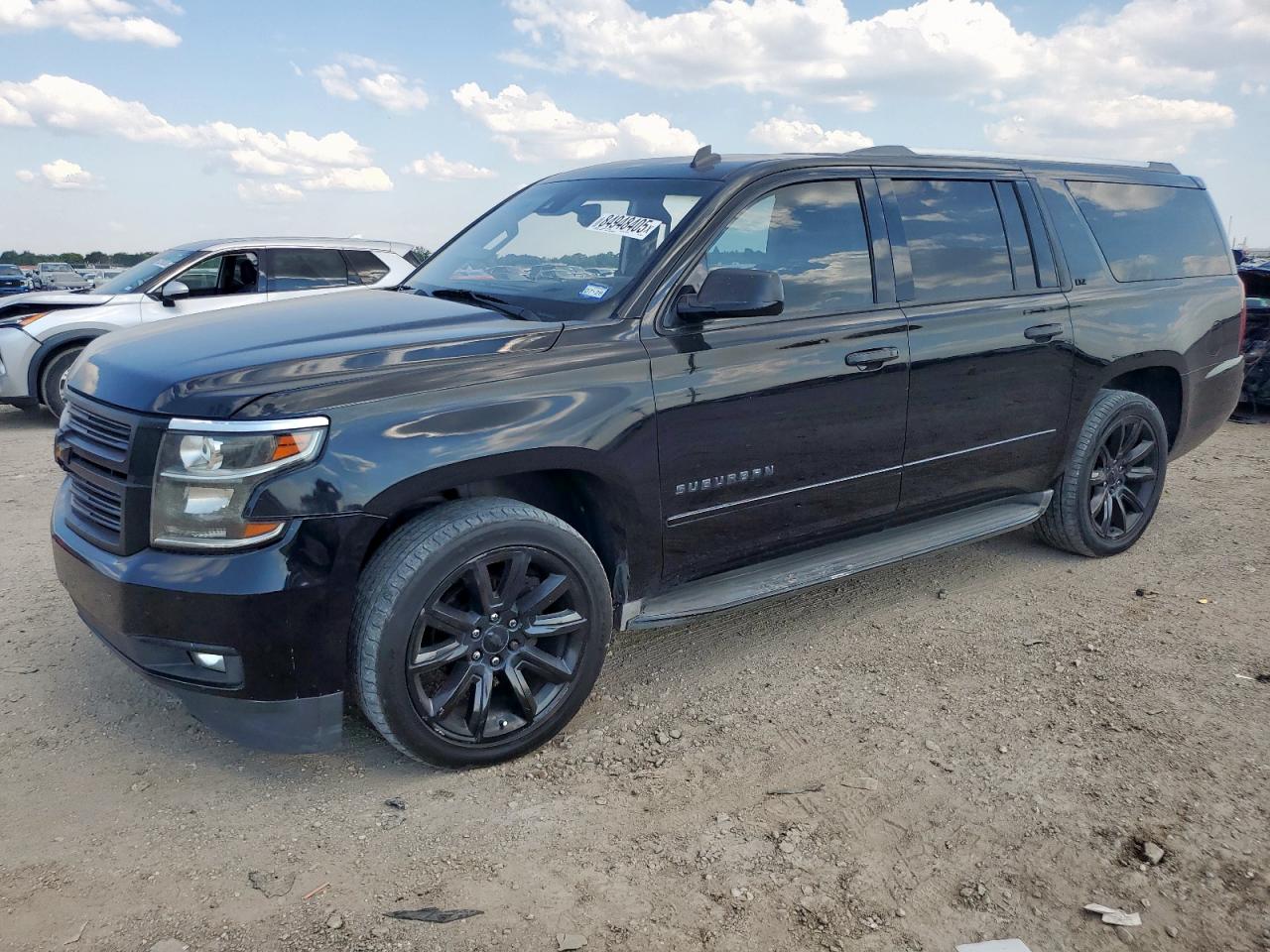 2015 Chevrolet Suburban LTZ, VIN 1GNSCKKCXFR287085 — Side