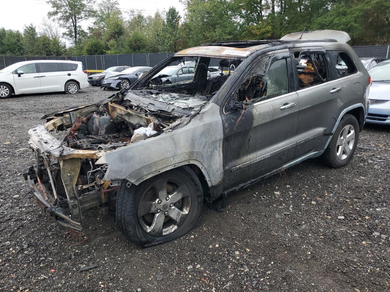 2011 Jeep Grand Cherokee Limited, VIN 1J4RR5GT3BC679090 — Engine fire