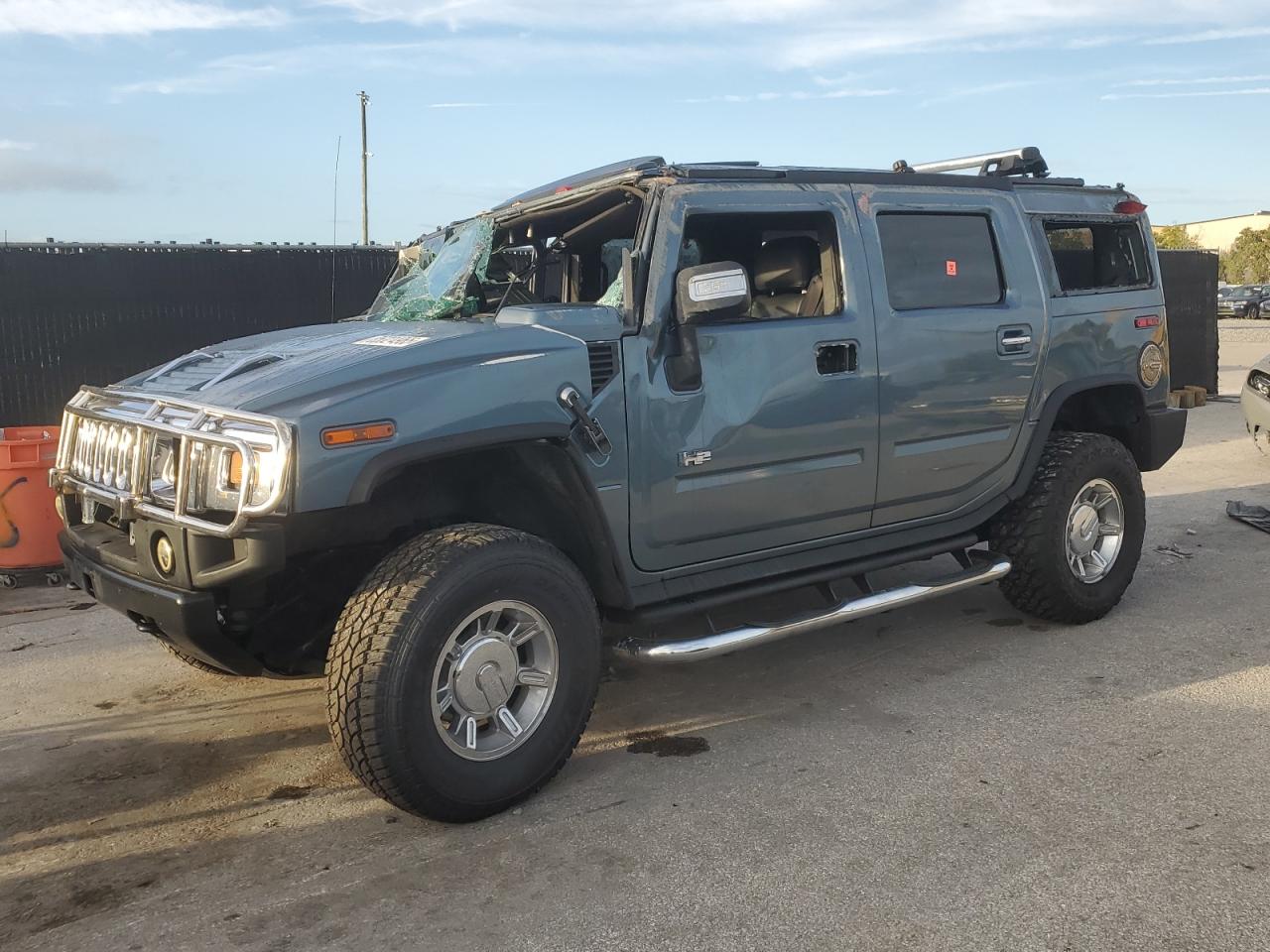 2005 Hummer H2 SUV, VIN 5GRGN23U55H102895 — Rollover