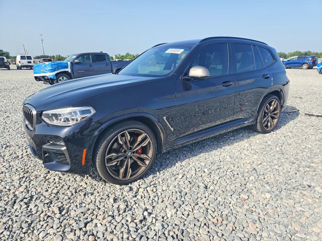 2021 BMW X3 M40i, VIN 5UXTY9C09M9G42791 — Side