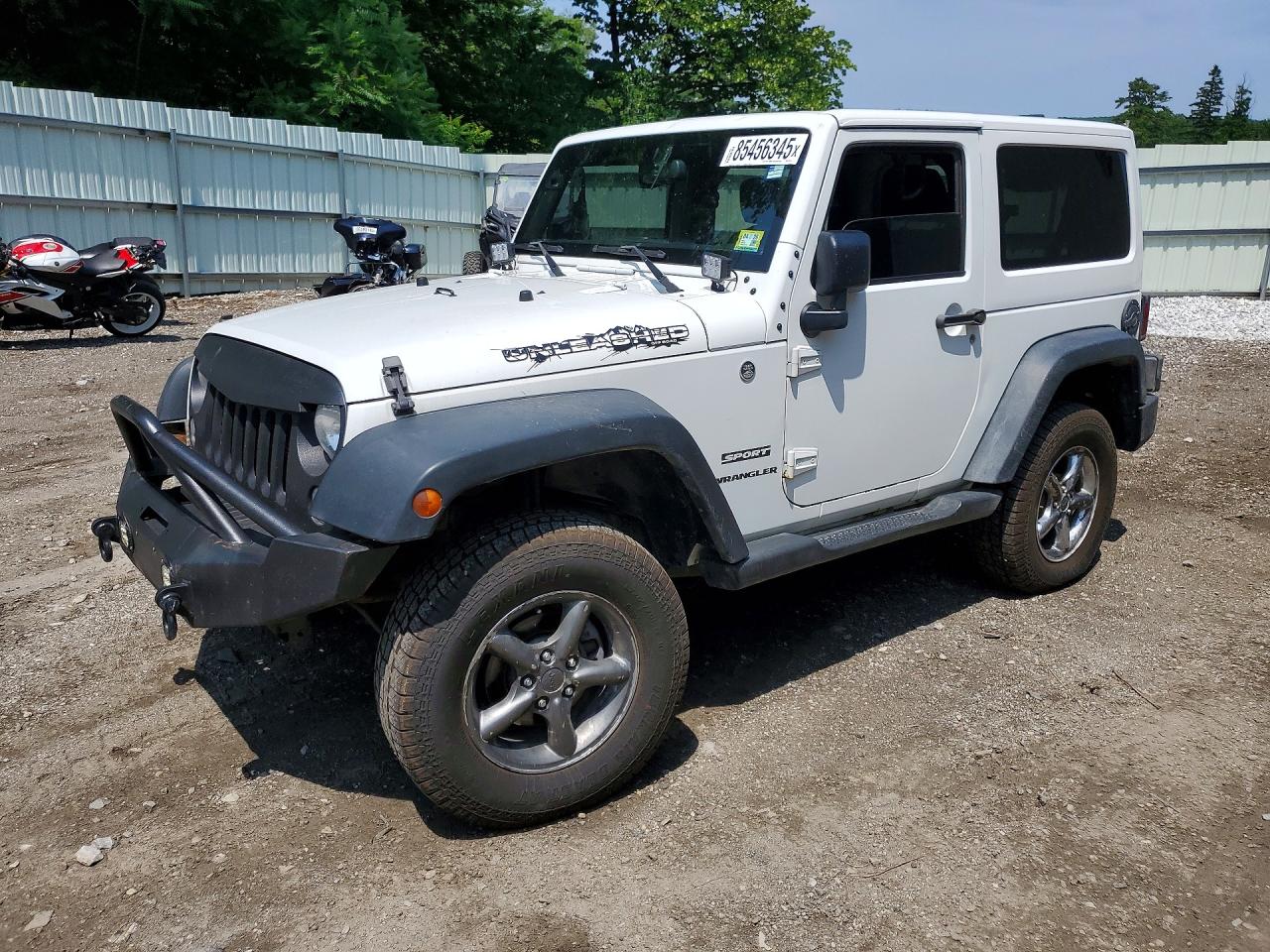 2015 Jeep Wrangler Sport, VIN 1C4AJWAGXFL529916 — Minor dents and scratches