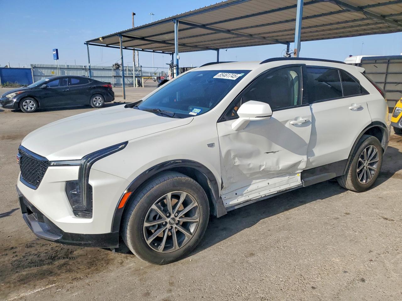 2024 Cadillac XT4 AWD Sport, VIN 1GYFZFR40RF159100 — Side