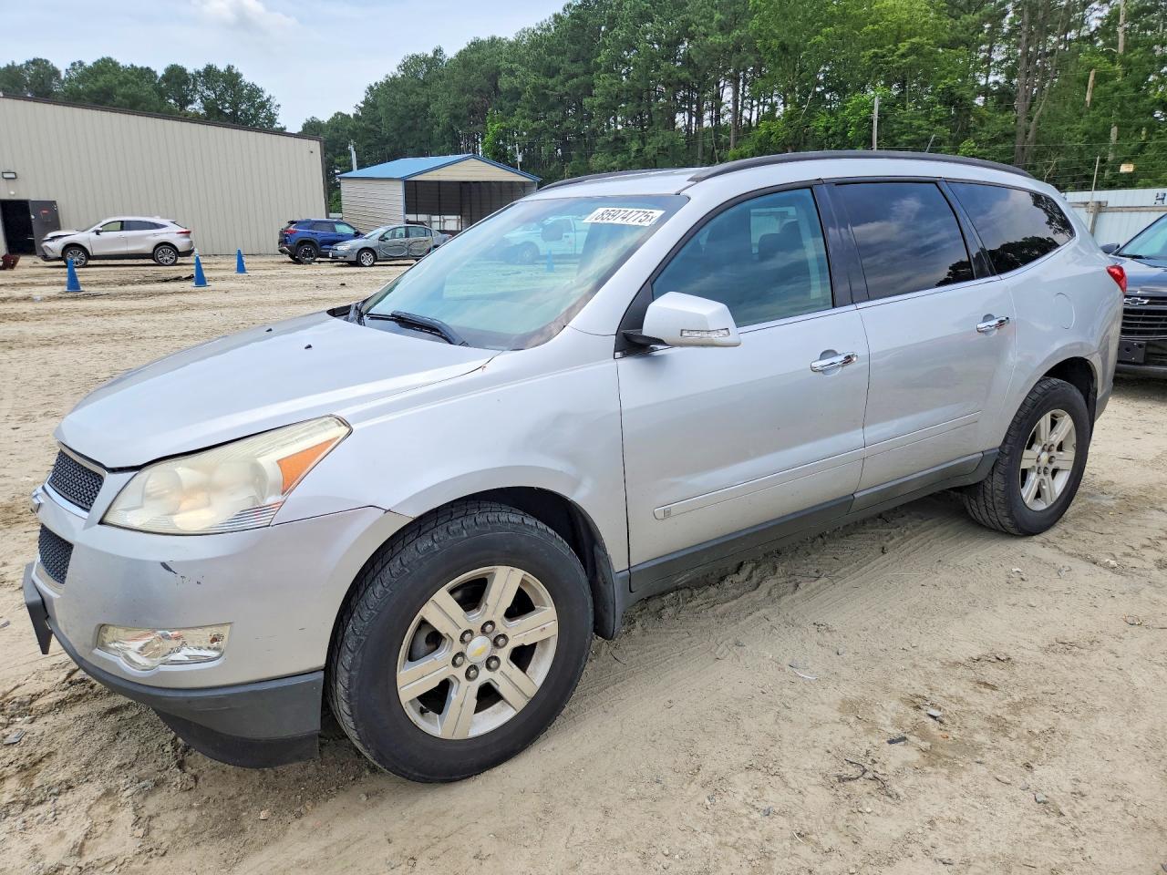 2010 Chevrolet Traverse 1LT, VIN 1GNLVFED9AS107526 — Side