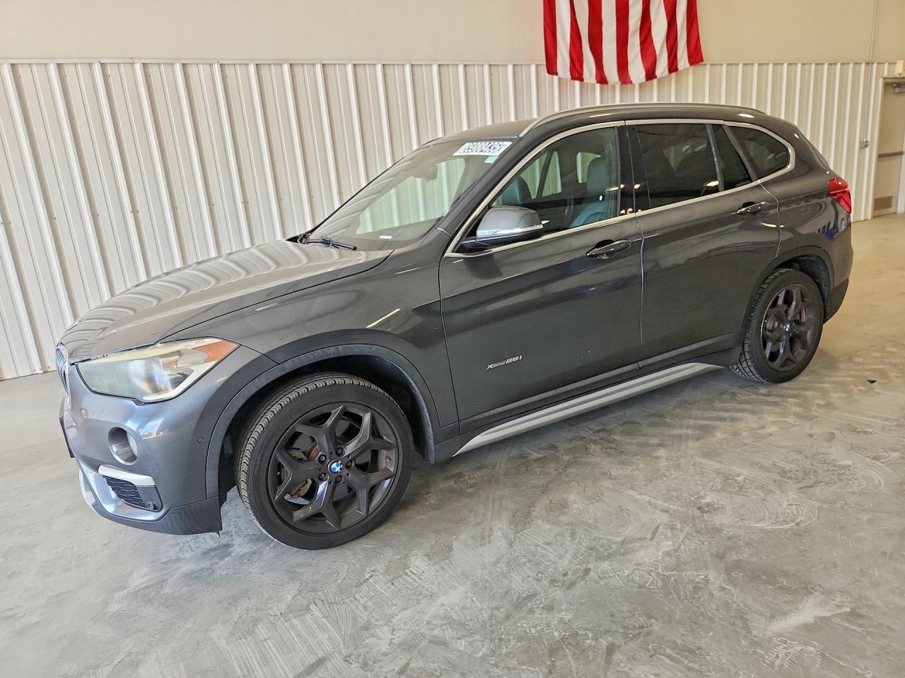 2016 BMW X1 xDrive28i, VIN WBXHT3C38GP887076 — Minor dents and scratches