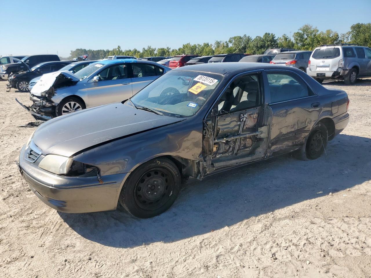 2000 Mazda 626 LX, VIN 1YVGF22C6Y5161025 — Side