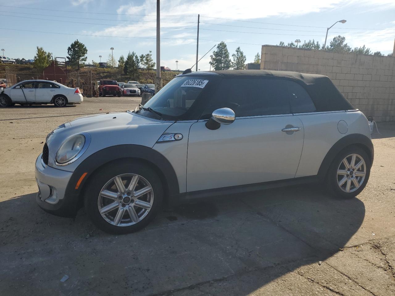 2011 MINI Convertible S, VIN WMWZP3C50BTX82858 — Side