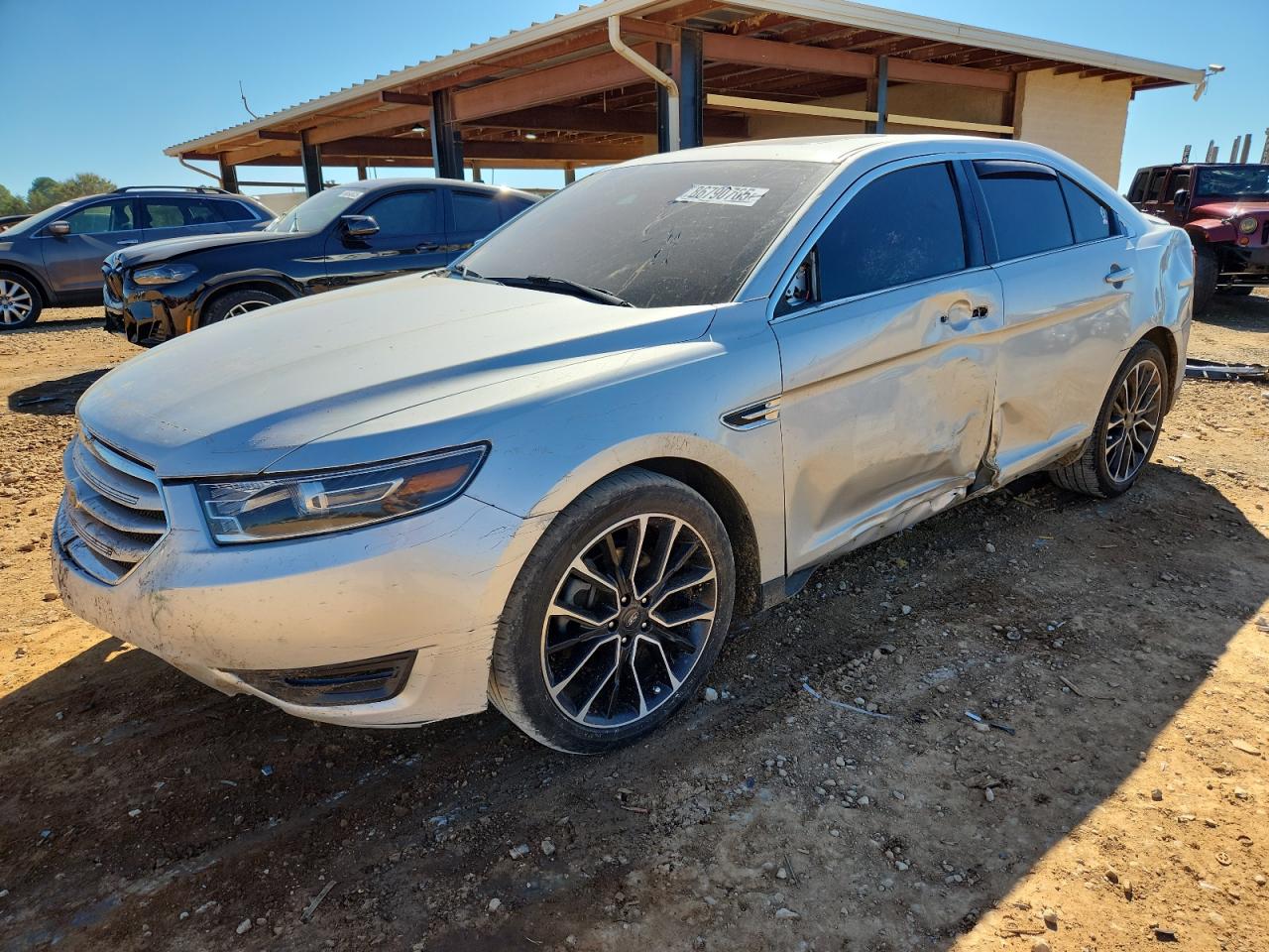 2019 Ford Taurus Limited, VIN 1FAHP2J88KG116044 — Side