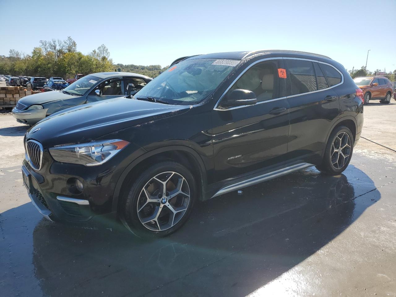 2018 BMW X1 xDrive28i, VIN WBXHT3C34J5K32030 — Side