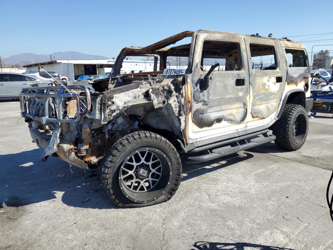 2003 Hummer H2, VIN 5GRGN23U43H138784 — Burn