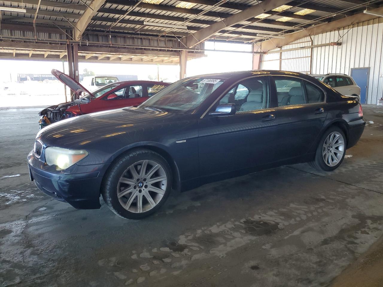 2005 BMW 7 Series 745i, VIN WBAGL63535DP76667 — Side