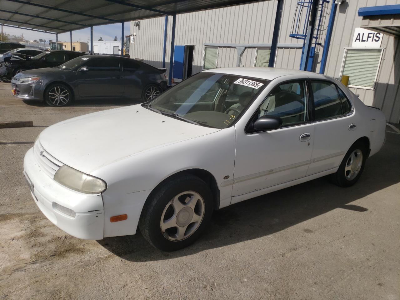 1997 Nissan Altima XE, VIN 1N4BU31D5VC173895 — Rear end