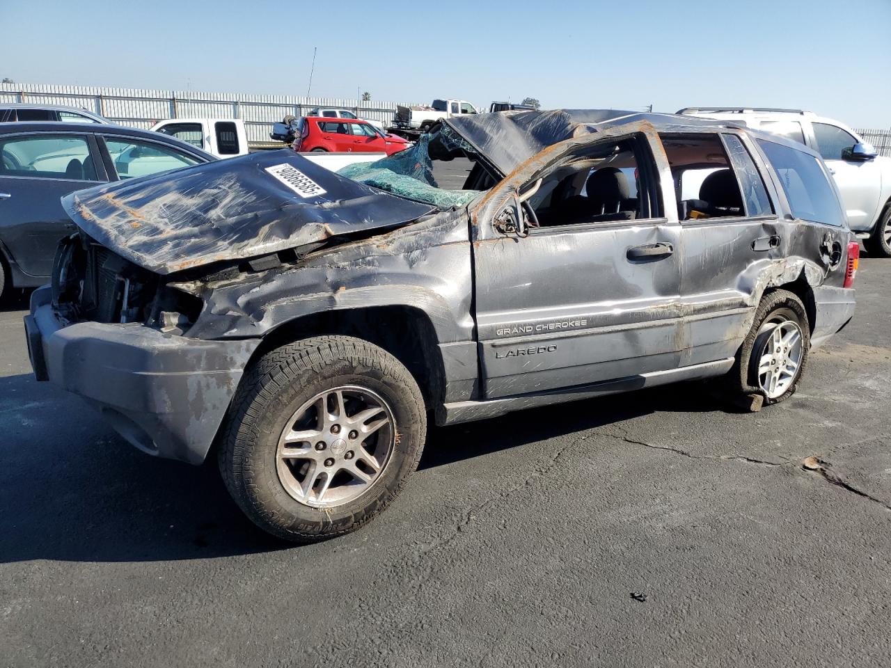 2004 Jeep Grand Cherokee Laredo, VIN 1J4GX48S34C304039 — Rollover