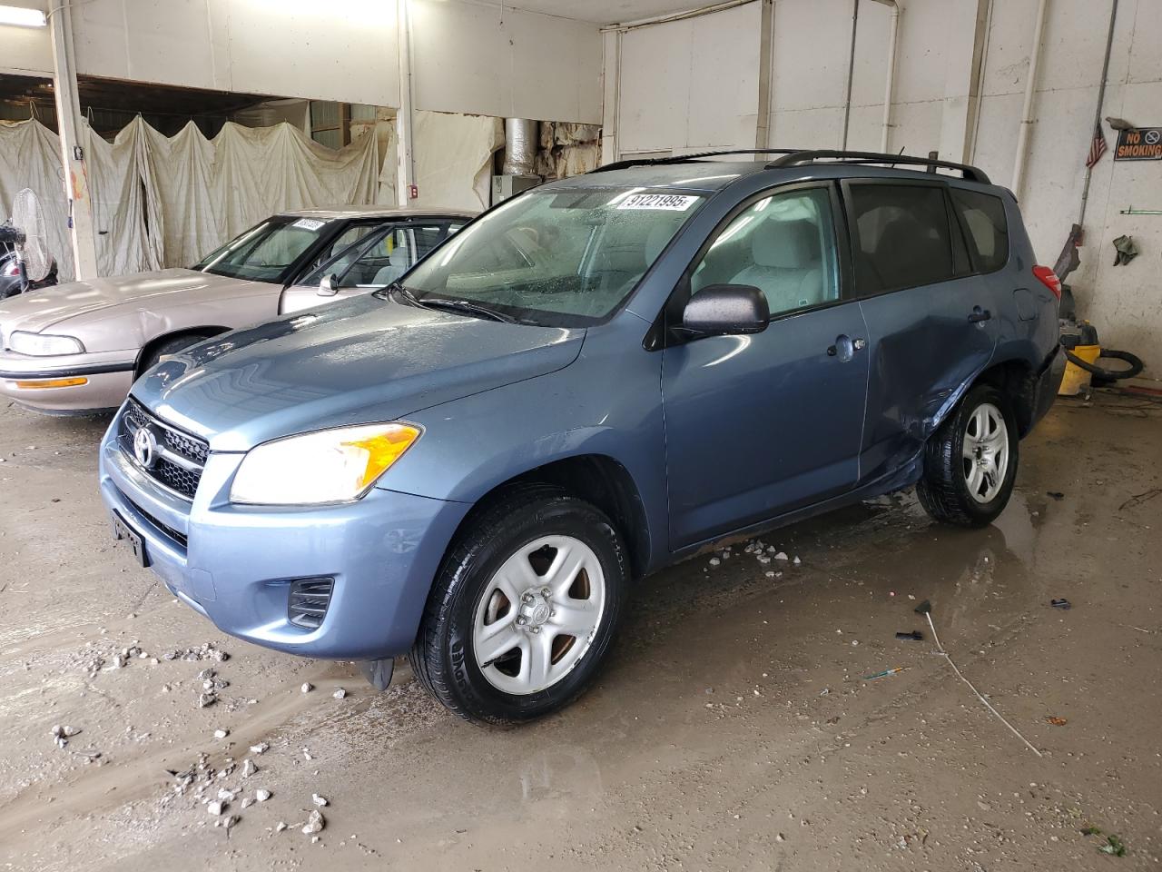 2011 Toyota RAV4, VIN 2T3ZF4DV8BW099331 — Side