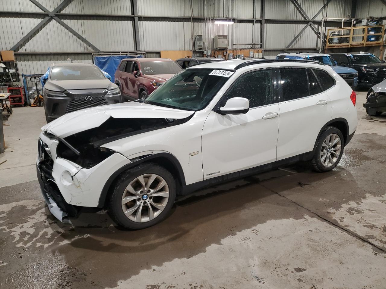2012 BMW X1 28i, VIN WBAVL1C52CVR80474 — Front end