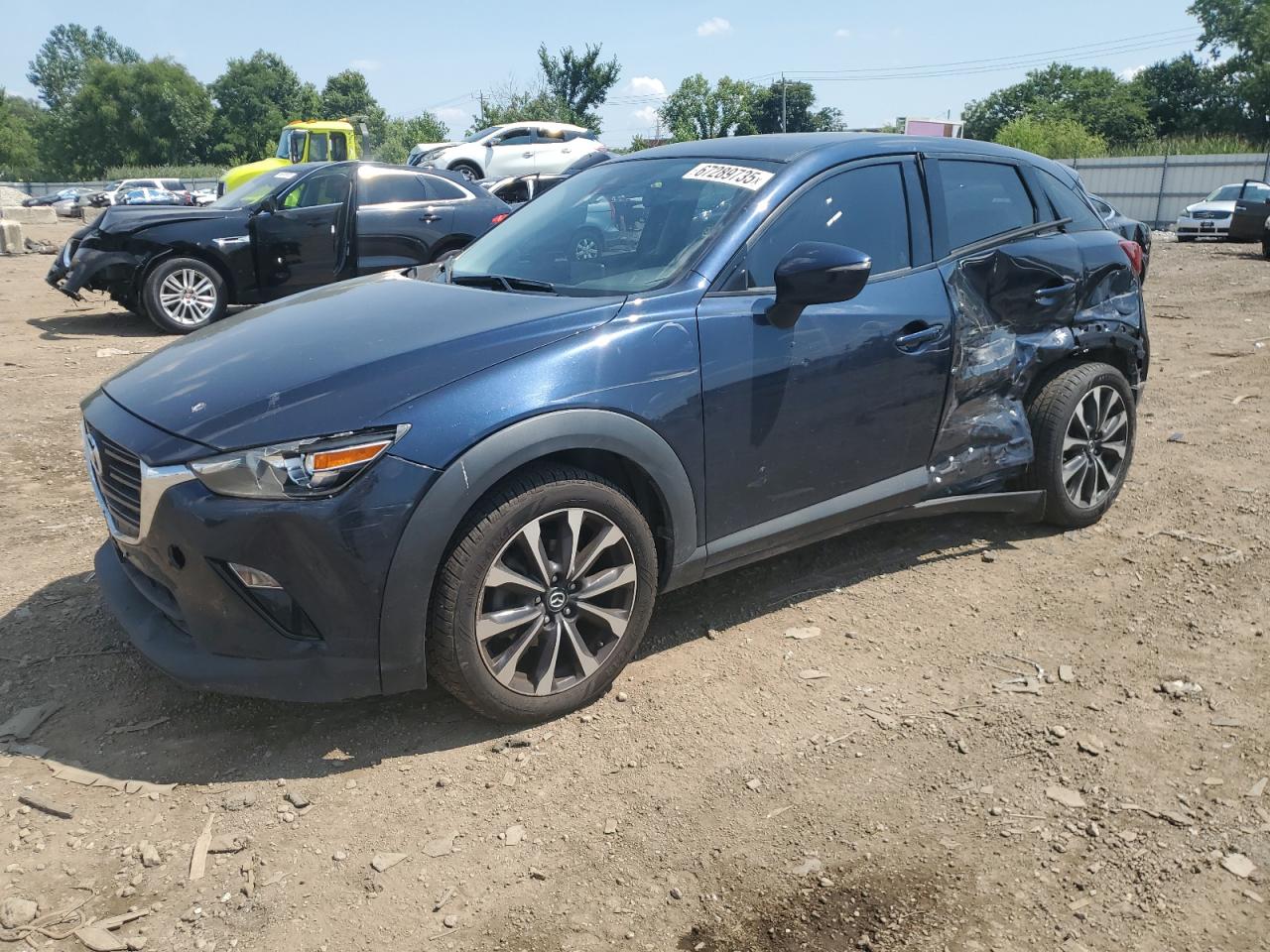 2019 Mazda CX-3 Touring, VIN JM1DKFC70K0426412 — Side