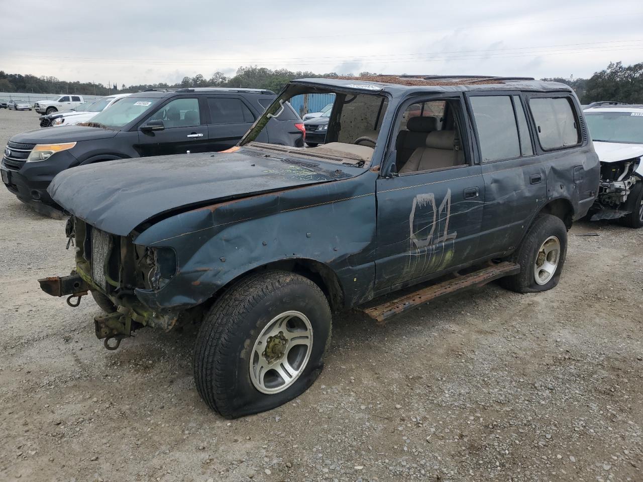 1995 Toyota Land Cruiser, VIN JT3DJ81W5S0103048 — Rollover