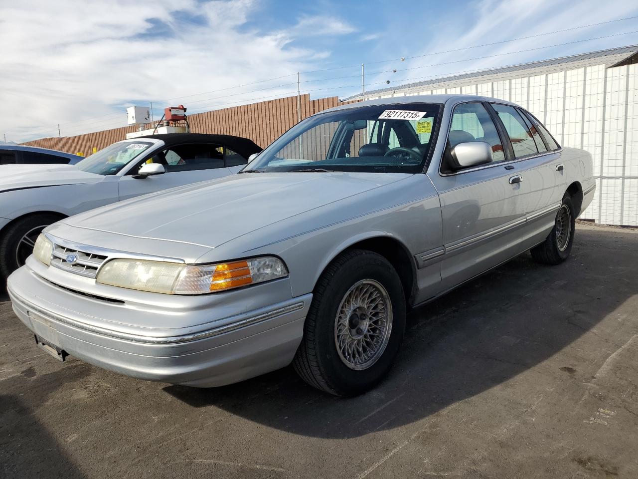 1996 Ford Crown Victoria LX, VIN 2FALP74W6TX195968 — Side