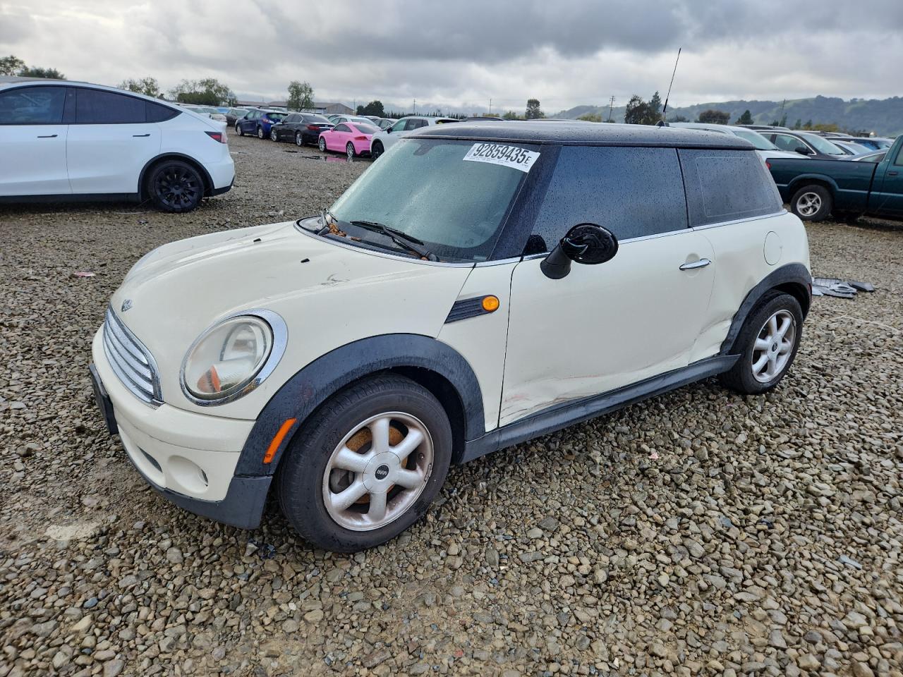 2010 MINI Hardtop, VIN WMWMF3C52ATU77440 — Бок