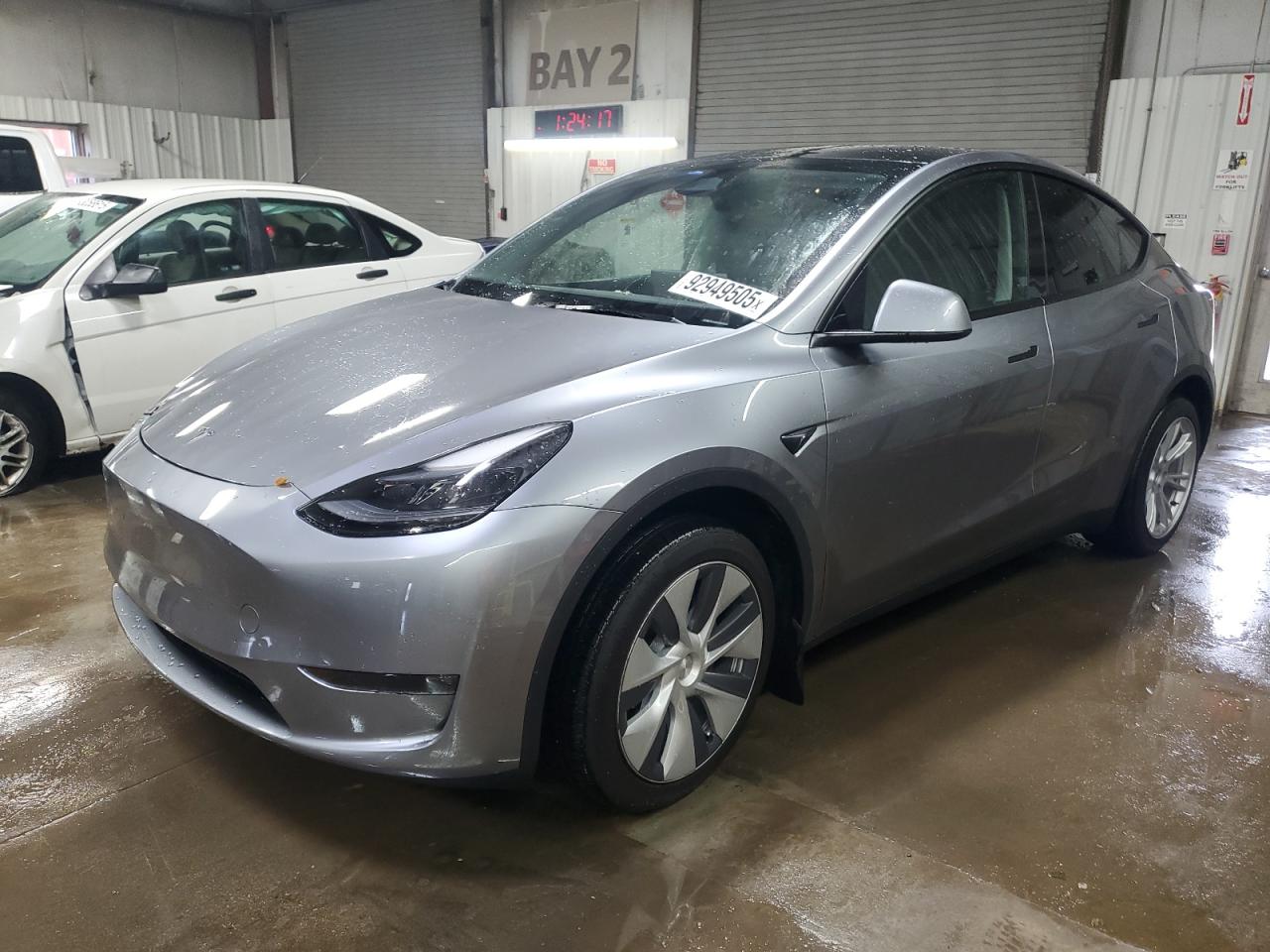 2024 Tesla Model Y Long Range, VIN 7SAYGDEE0RA287753 — Side