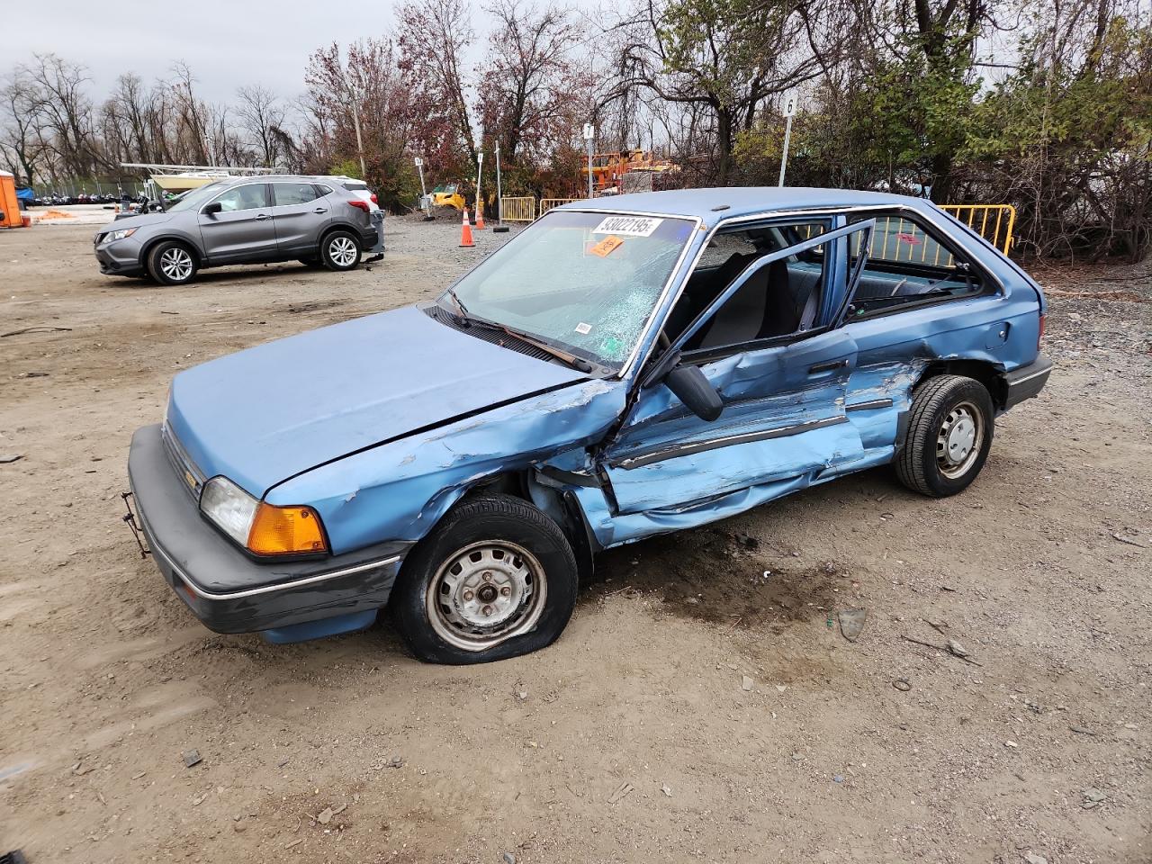1988 Mazda 323, VIN JM1BF2320J0139580 — Side
