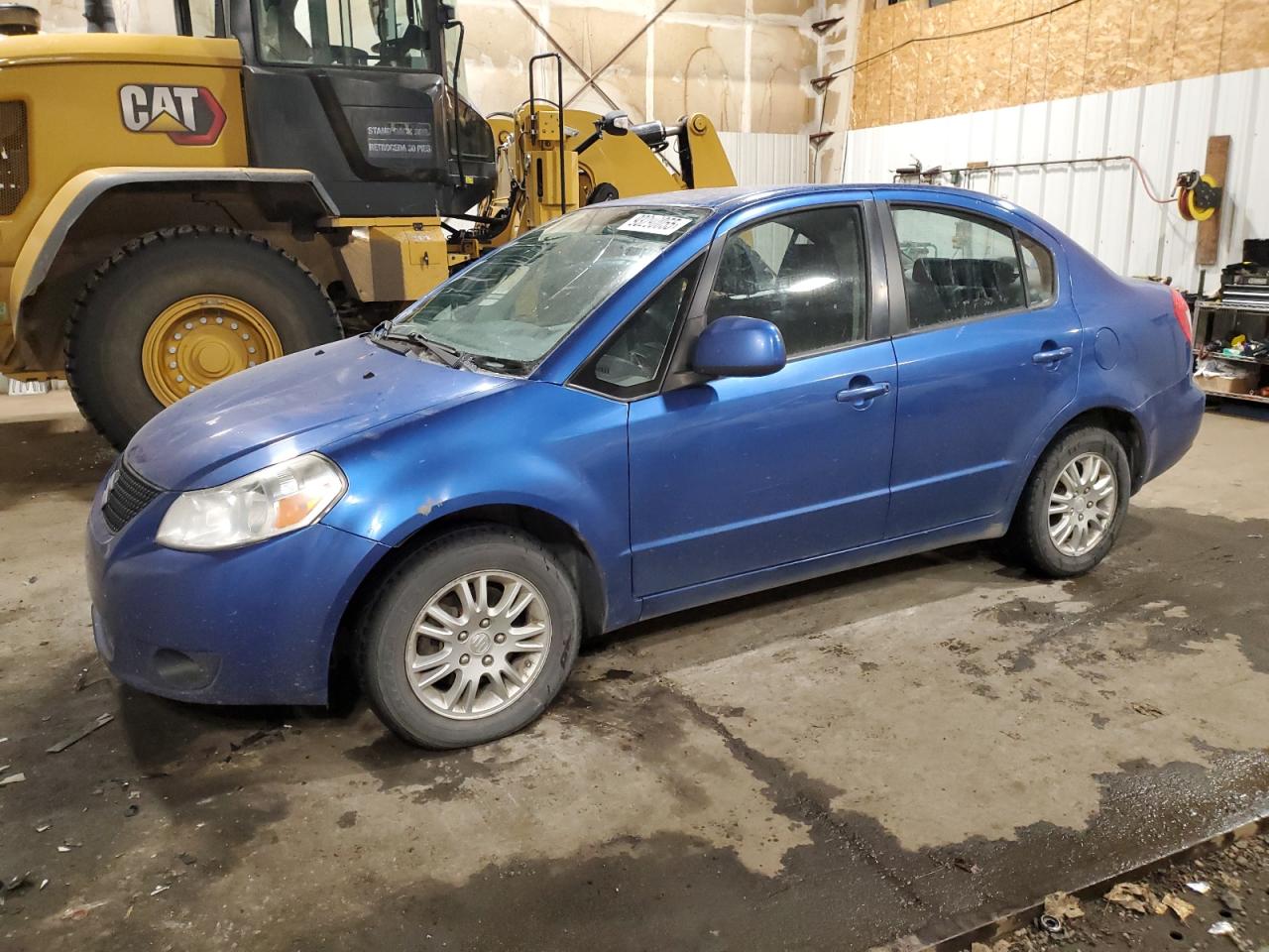 2012 Suzuki SX4 LE, VIN JS2YC5A37C6303736 — Side