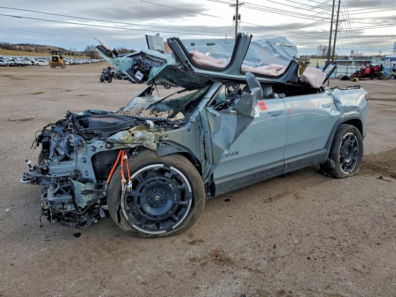 2025 Rivian R1S Adventure, VIN 7PDSGBBA9SN052621 — Rollover
