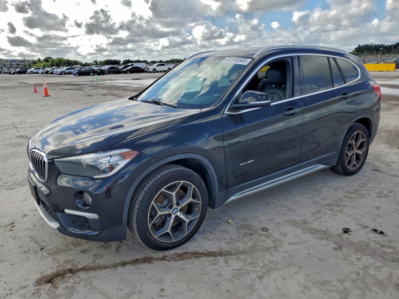 2018 BMW X1 xDrive28i, VIN WBXHT3C39J5K24876 — Rear end