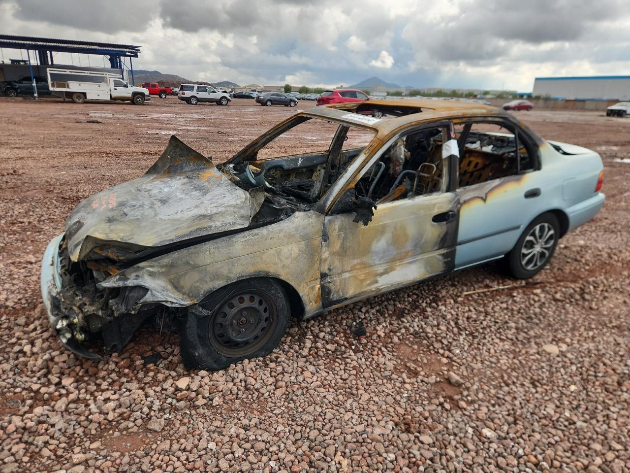 1995 Toyota Corolla DX, VIN 1NXAE09B1SZ345314 — Burn