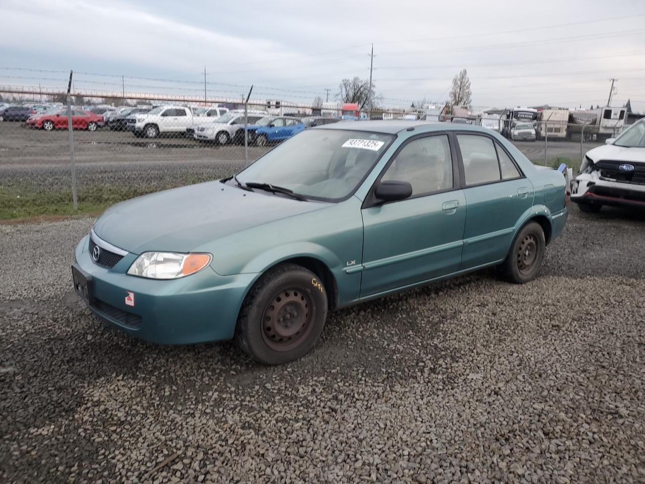 2001 Mazda Protege DX, VIN JM1BJ222610448065 — Бок