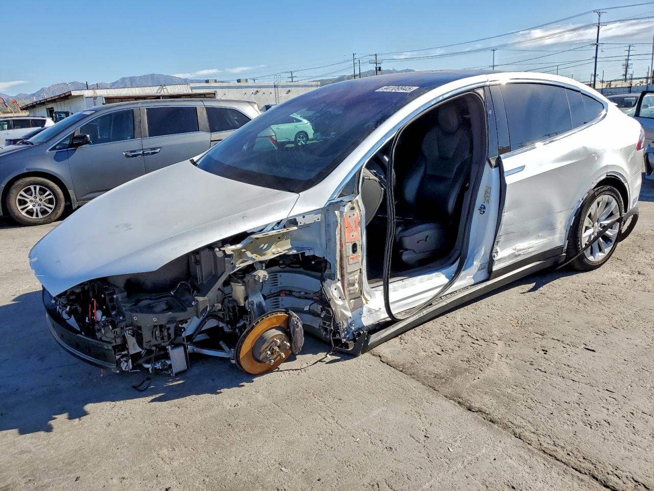 2021 Tesla Model X Long Range Plus, VIN 5YJXCDE24MF321599 — Side