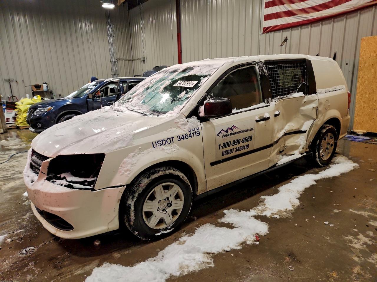2012 Ram Cargo Van, VIN 2C4JDGAG7CR404727 — Side