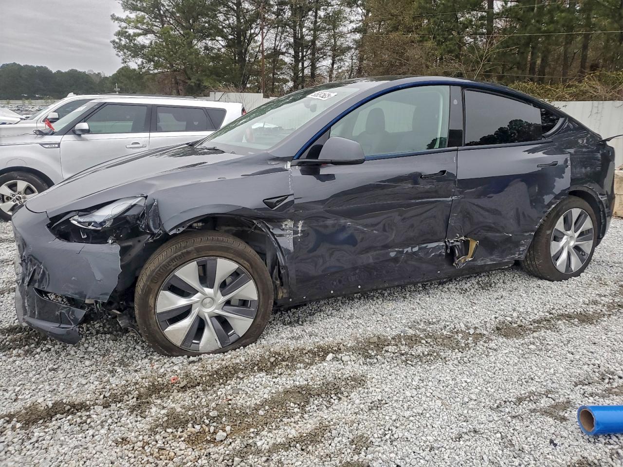 2024 Tesla Model Y Long Range, VIN 7SAYGDEEXRF991929 — Side