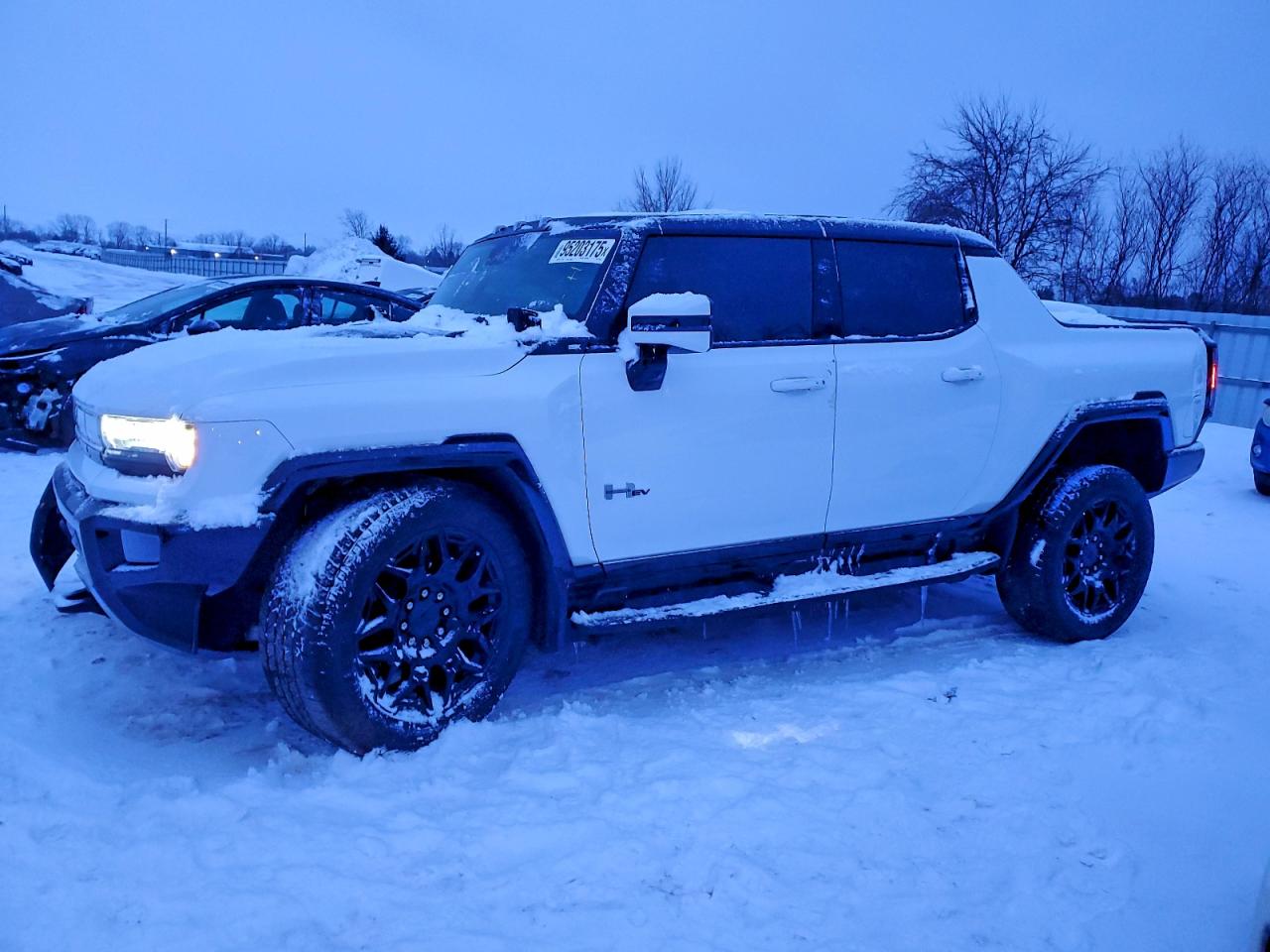 2024 GMC HUMMER EV Pickup 2X, VIN 1GT10BDD0RU101154 — Undercarriage