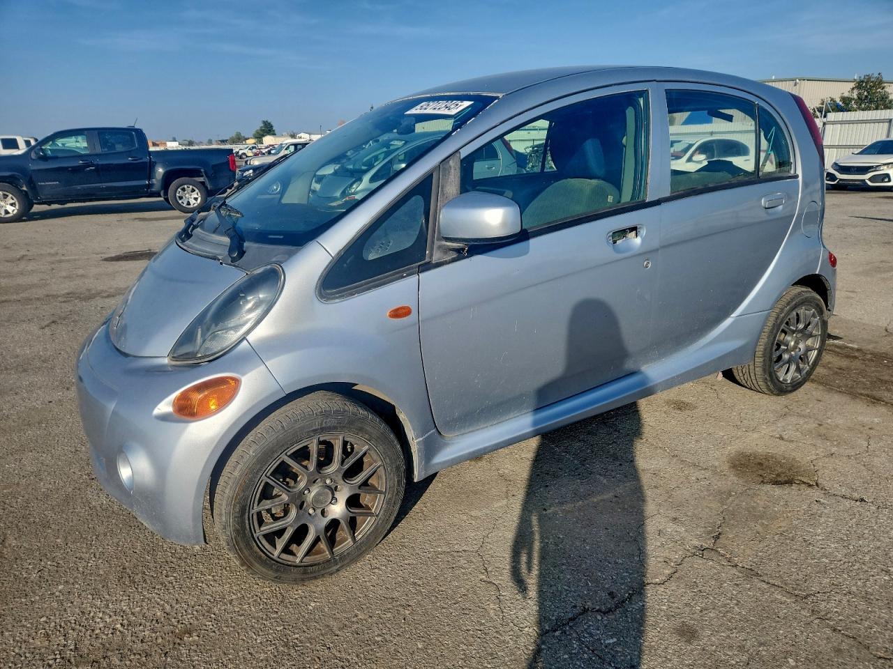 2012 Mitsubishi i-MiEV ES, VIN JA3215H14CU018318 — Side
