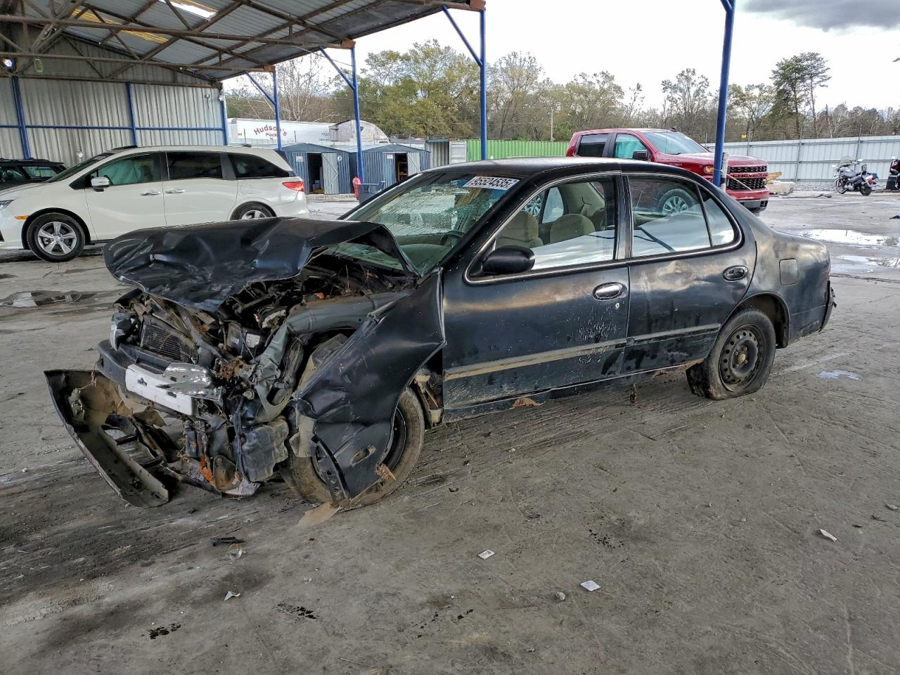 1997 Nissan Altima XE, VIN 1N4BU31D9VC256200 — Rollover