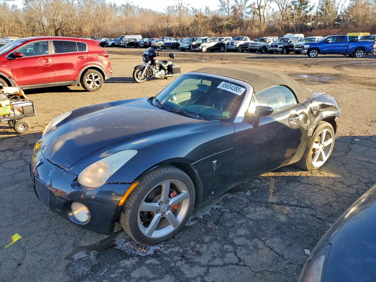 2009 Pontiac Solstice, VIN 1G2MB35BX9Y102951 — Side