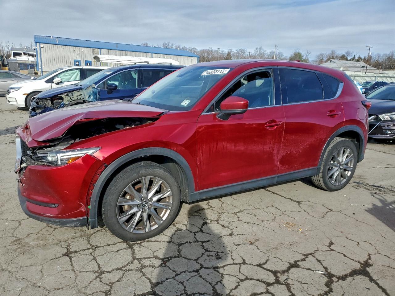2021 Mazda CX-5 Grand Touring, VIN JM3KFBDM4M1442707 — Front end
