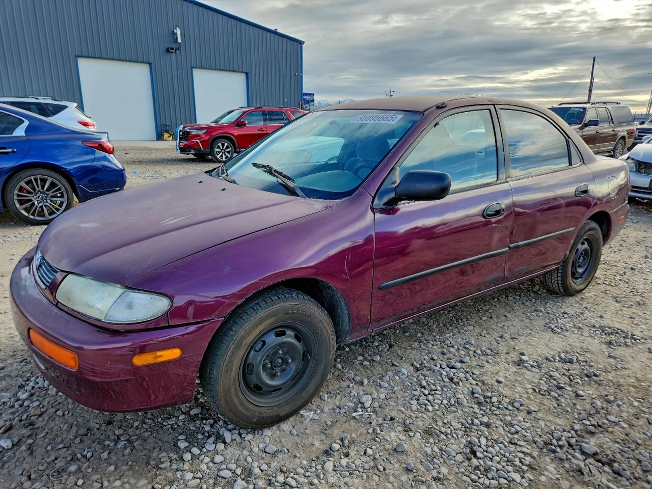 1996 Mazda Protege DX, VIN JM1BB1415T0330877 — Бок