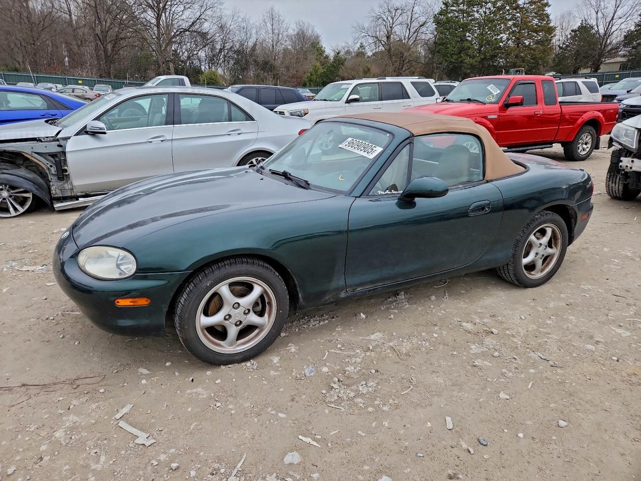 1999 Mazda MX-5 Miata, VIN JM1NB3530X0138331 — Side